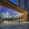Modern Entrance Gate With Glass Walls And Wooden Accents At Night