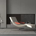 Modern Cream Upholstered Lounge Chair with Orange Cushions Near Gray Fireplace and Side Table
