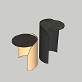 Two Modern Side Tables in Beige and Black with Curved Legs and Round Wooden Tops