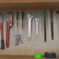 Practical Tool Set with Pliers Wrenches Saws and Tape Rolls on Wooden Shelf