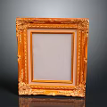 Ornate Golden Picture Frame With Intricate Carvings And Smooth Dark Surface