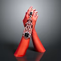 Red Hand Model Displaying Stylish Wrist Accessory With Geometric Patterns And Black Gemstones