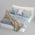Cozy Modern Double Bed With Blue Sheets Beige Blanket And Wooden Stools