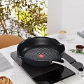 Kitchen Island With Marble Countertop Frying Pan Induction Cooktop Coffee And Green Plants