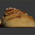 Swirled Cinnamon Roll With Golden Brown Surface And White Sugar Sprinkles