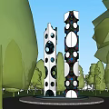 Tall Outdoor Sculpture With Circular Holes And Colorful Patterns In Park With Trees