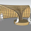 Curved Wooden Architectural Structure With Seating Area Where People Relax In Public Space