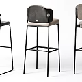 Modern Minimalist Bar Stools With Black Metal Frames And Upholstered Seats