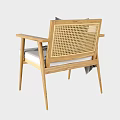 Modern Wooden Armchair With Grey Cushion And Blanket On Armrest