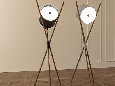 Two Modern Floor Lamps With Wooden Cross Legs And Round White Shades In Interior 3d model