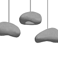 Three Gray Fabric Pendant Lights With Irregular Shape Hanging On Light Colored Wall 3d model