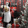 Christmas Shop Window Display Featuring Dior Shopping Bag Gift Boxes Wine Bottles Mannequin and Decorated Tree