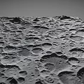 Stunning Lunar Landscape Featuring Scattered Craters And Gray Rocky Terrain