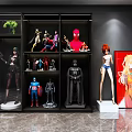 Collectible Action Figures Display In Modern Cabinet With Various Character Models And Poster