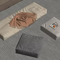 Modern Home Setup With Gray Cushions Brown Blanket And Striped Rug