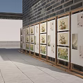 Outdoor Photo Wall With Wooden Display Racks And Artworks In Courtyard With Gray Stone Pavement
