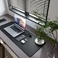 Organized Office Desk Setup With Laptop Phone Glasses Earbuds And Green Plant By Window