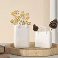 White Square Vases With Handle Holding Yellow Flowers On Wooden Tray With Pinecones And Books