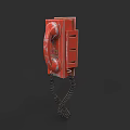 Vintage Red Mobile Phone With Dial Pad And Coiled Cord