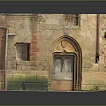 Ancient Arched Entry Gate With Brick Stone Wall And Green Moss Wooden Door