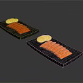 Fresh Salmon Slices Arranged on Black Stone Plates with Lemon Slices