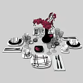 Elegant Dinnerware Set With Plates Glasses Cutlery And Red Flower Vase Arrangement