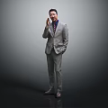 A Man In Gray Suit Red Tie Talking On Phone With Hand In Pocket