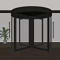 Modern Revolving Door with Glass Panels and Metal Frame in Interior Space with Plant