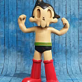 Muscular Cartoon Character Doll With Black Hair Green Belt And Red Socks
