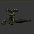 Ancient Bronze Artifact With Mythical Beast Head Design And Green Patina Surface