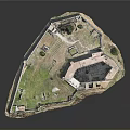 Historical Ancient Fortress Structure With Encircling Walls Green Grass And Trees