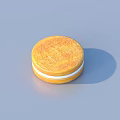 Golden Round Cookies Stacked in Black Box Perfect for Snacking Treats