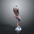 Falcon Sculpture Perched On Person's Arm With White Base And Gray Background