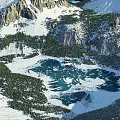 Breathtaking Mountain Landscape With Snow Capped Peaks Turquoise Lake And Lush Green Forest