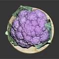 Fresh Purple Cauliflower with Green Leaves Displayed on Wooden Round Board