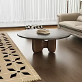 Modern Living Room Interior With Round Wooden Coffee Table And Patterned Rug