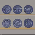 Blue Decorative Plates With Intricate Zodiac Designs Displayed On Wooden Shelves