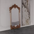 Ornate Gold Carved Mirror Standing by White Wall With Decorative Textured and Dark Wooden Floor