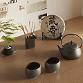 Traditional Japanese Teaset with Teapot Teacups Tea Cake and Green Plant on Wooden Tabletop