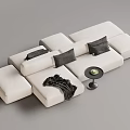 Modular Cream Sectional Sofa With Black Cushions Blanket And Small Round Table 3d model