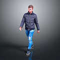 Man Walking in Dark Blue Puffer Jacket Blue Jeans and Black Shoes on Gray Background