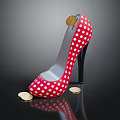 Red Polka Dot High Heels with Coin on Heel and Scattered Coins on Black Background
