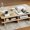 Wooden Coffee Table With Shelves On Woven Rug Featuring Open Magazine Books And Glass Bottle
