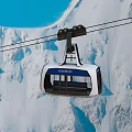 Scenic Cable Car Ride Over Snowy Mountain Peaks Under Clear Blue Sky