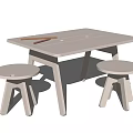 White Kids Table With Two Matching Stools Pencils And Paper On Top Surface