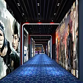 Modern Cinema Hallway With Blue Carpet Movie Posters Lighting And Hall Number Sign
