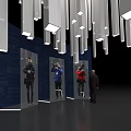 Silver Elongated Art Installation Hanging Above Blue Backdrop With Figure Models