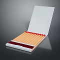 Open White Matchbox With Neatly Arranged Red Match Heads On Dark Background