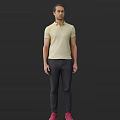 Man Wearing Yellow Polo Shirt And Dark Pants Standing Against Dark Background