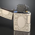 Silver Metal Lighter With Intricate Engraved Patterns And Open Lid Design